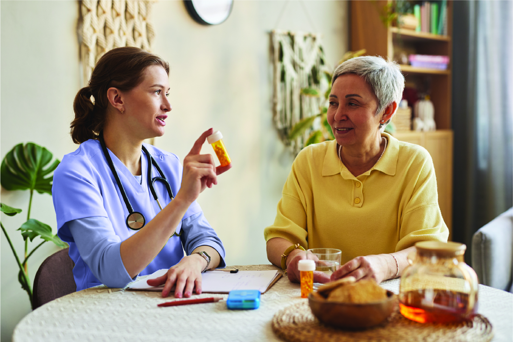 Nurse Practitioner explains medication to an older patient